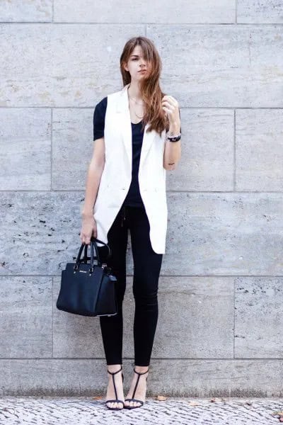 White Sleeveless Blazer with All-Black Outfit