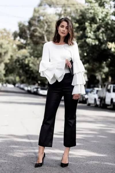 White Bell Sleeve Ruffle Blouse with Black Cropped and Flared Chinos