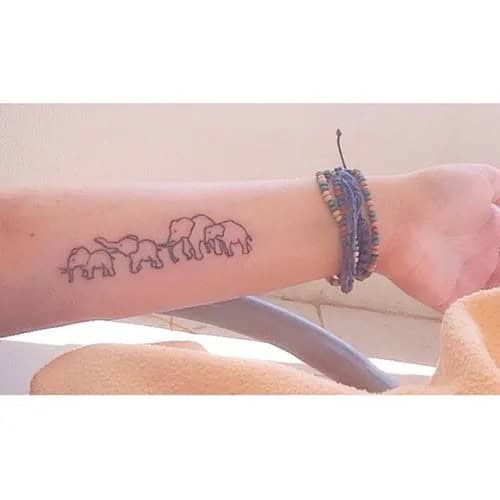 Small and Cute Elephant with Trunk Down Tattoo on Inner Arm