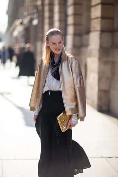 Gold Bomber Jacket with White Blouse & Black Chiffon Skirt