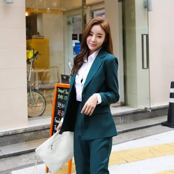 White Button Up Shirt with Dark Green Suit & Pale Pink Clutch Bag