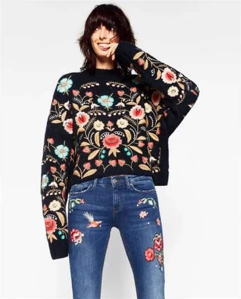 All-Embroidered Outfit with Black Sweater & Blue Jeans