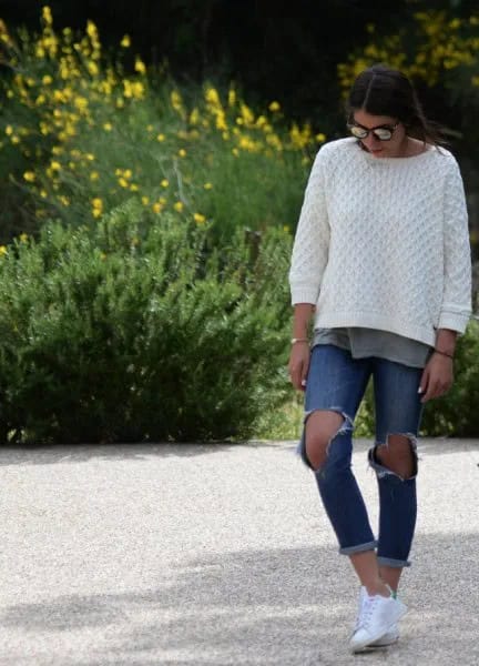 White Cable Knit Sweater with Ripped and Cuffed Blue Jeans