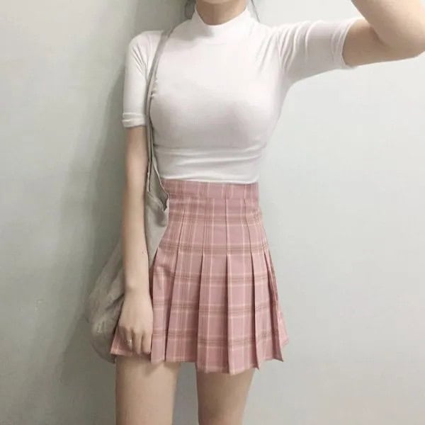 White Mock Neck Form Fitting Tee with High Waisted Pink Pleated Mini Skirt