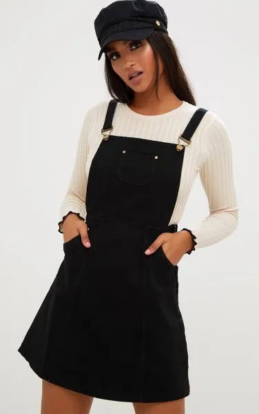 Black Denim Pinafore Dress with White Ribbed Sweater & Flat Cap