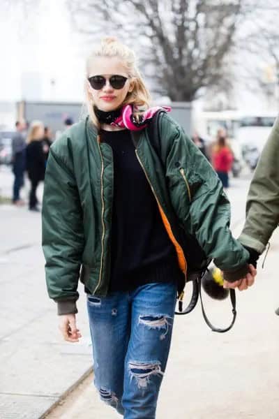 Black Flight Jacket with Crew Neck Sweater & Ripped Blue Jeans