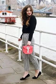 Black Sweater with Checkered Pants & Red Purse