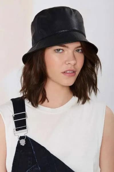 Black Leather Bucket Hat with White Sleeveless Top & Denim Overall