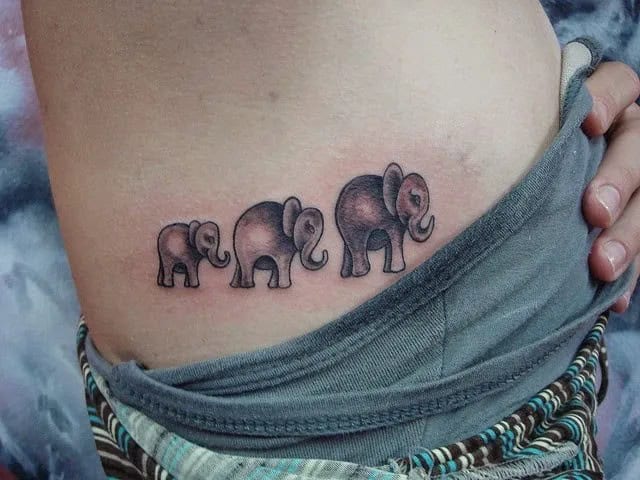 Elephant Family Making a Link and Walking in a Line Tattoo Design