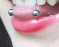 What does a snake eyes piercing look like?