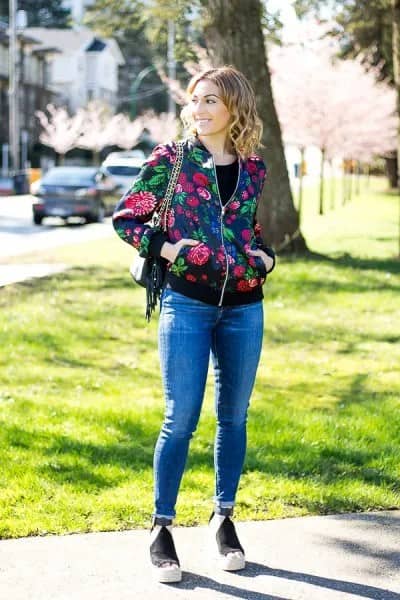 Black and Red Floral Bomber Jacket with Blue Jeans