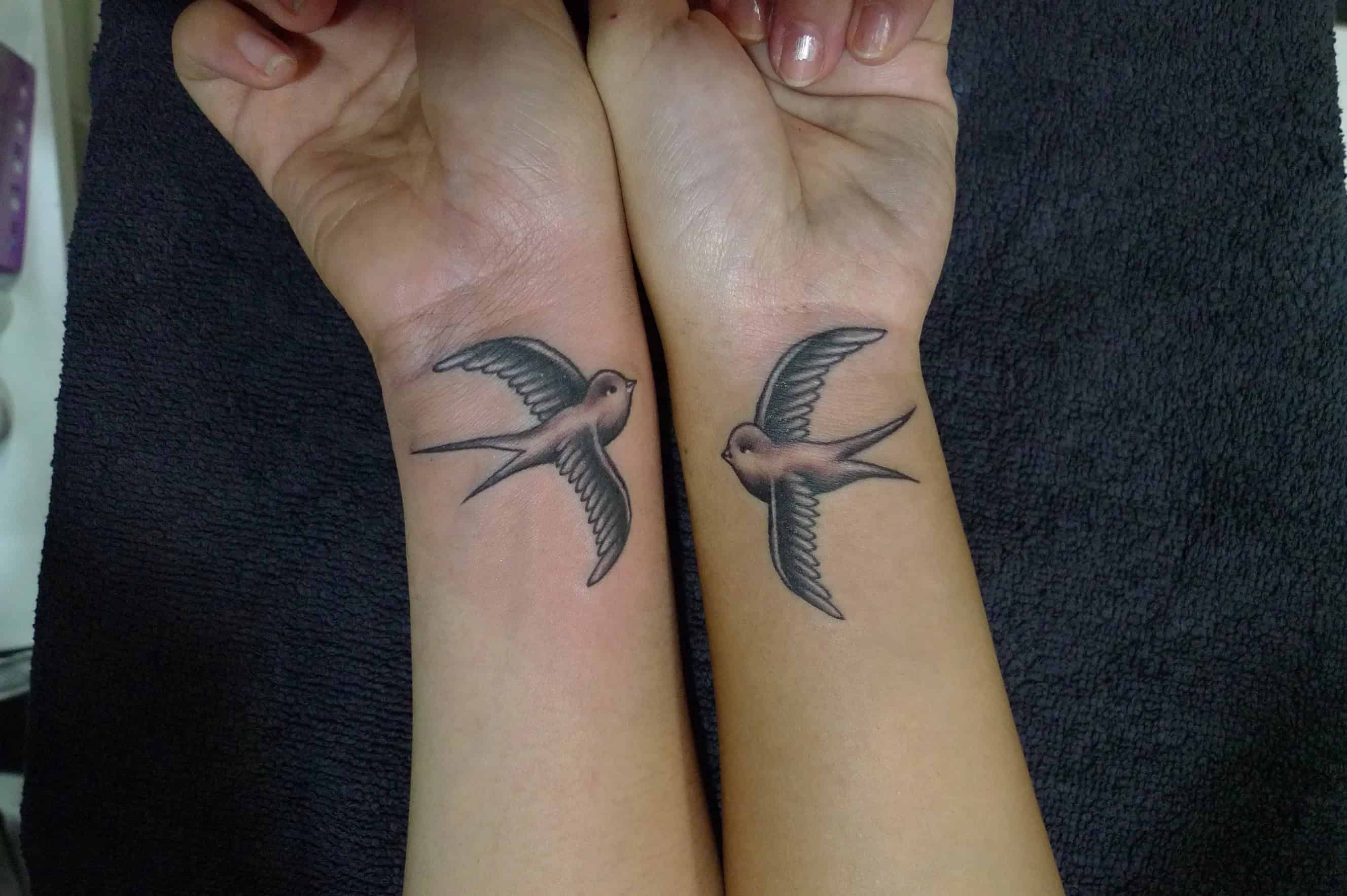 Matching sister tattoos