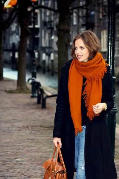 Black Long Wool Coat with Blue Skinny Jeans & Orange Knit Scarf