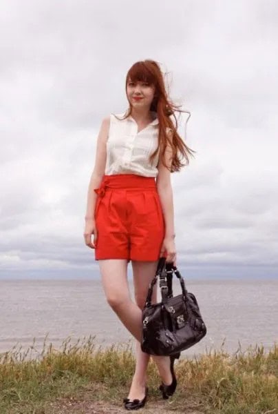 White Sleeveless Chiffon Blouse with Orange High Rise Pleated Shorts