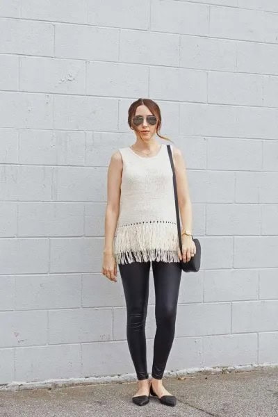 White Sleeveless Knit Sweater with Black Leather Leggings