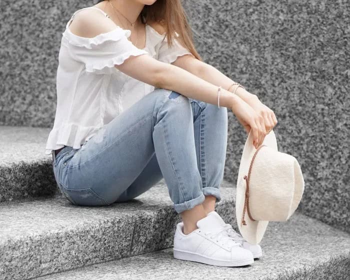 White Ruffle Cold Shoulder Top with Light Blue Skinny Jeans