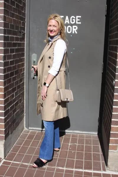 Camel Sleeveless Coat with Blue Flared Jeans