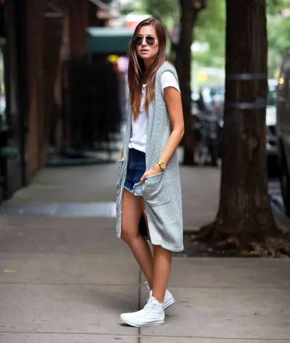 White Converse with Long Sleeveless Cardigan & Denim Shorts