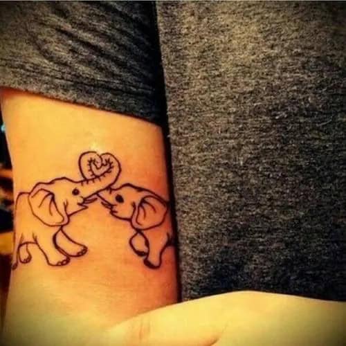 Small and Cute Elephant with Trunk Down Tattoo on Inner Arm