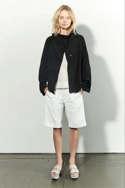 Black Bomber Jacket with Pale Pink Sweater & White Long Shorts