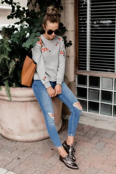 Grey Embroidered Sweatshirt with Blue Ripped Skinny Jeans