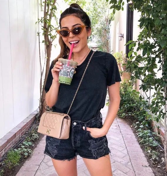 Black T shirt with Ripped Denim Shorts & Pink Purse