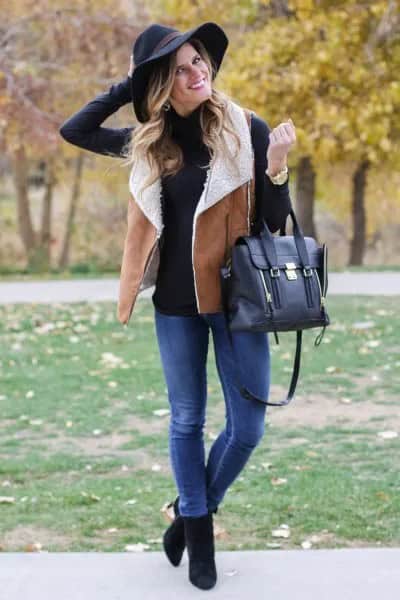 Black Mock Neck Sweater with Camel Shearling Vest & Blue Jeans