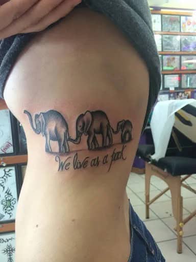 Elephant Family Making a Link and Walking in a Line Tattoo Design