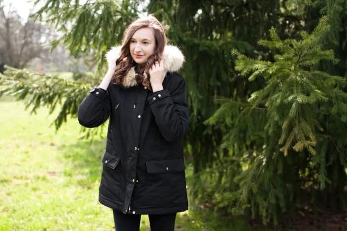 Black Trench Coat with White Faux Fur Hood & Skinny Jeans