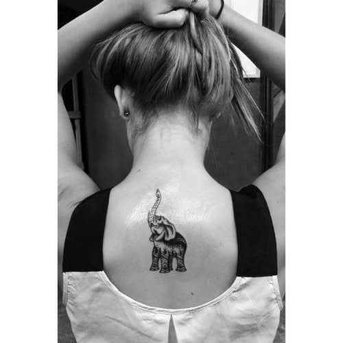 Elephant with Trunk Up Tattoo Designs at the Back of the Neck