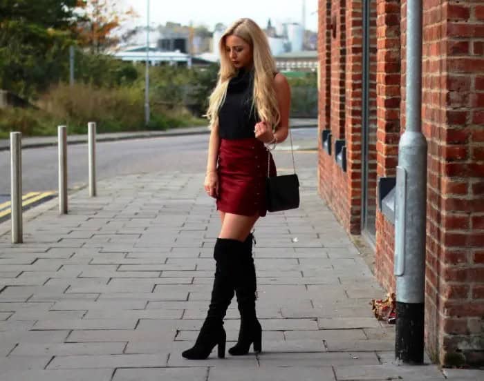 Black Mock Neck Sleeveless Top with Burgundy Mini Skirt & Heeled Tall Boots