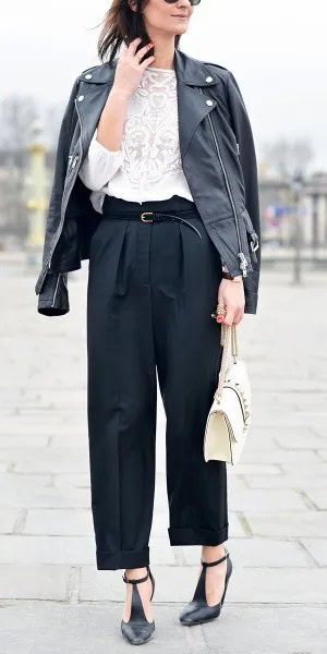 White Lace Top with Black Leather Jacket Draped Over Shoulders