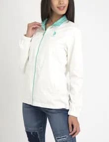 White Polo Windbreaker with Blue Ripped Skinny Jeans