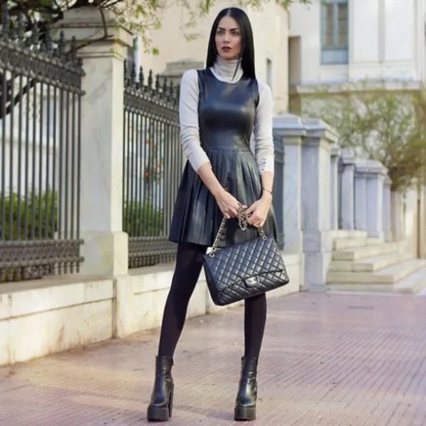 Black Leather Pleated Skater Dress Over Turtleneck Sweater