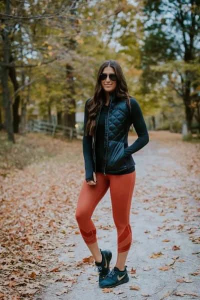 Black Leather Down Vest with Fitted Sweater & Green Cropped Leggings