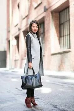 Grey Midi Length Wool Sleeveless Coat over Black Leather Jacket