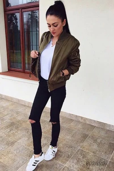 Olive Bomber Jacket with White V Neck Blouse & Black Ripped Jeans