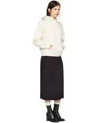 White Hoodie with Black Midi Skirt & Leather Heeled Boots