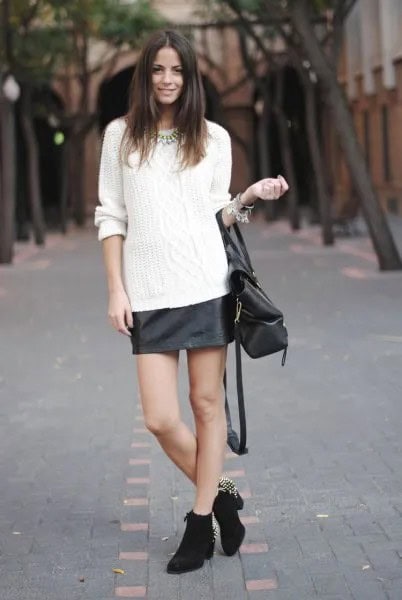 White Cable Knit Sweater with Black Leather Skirt & Heeled Mini Boots