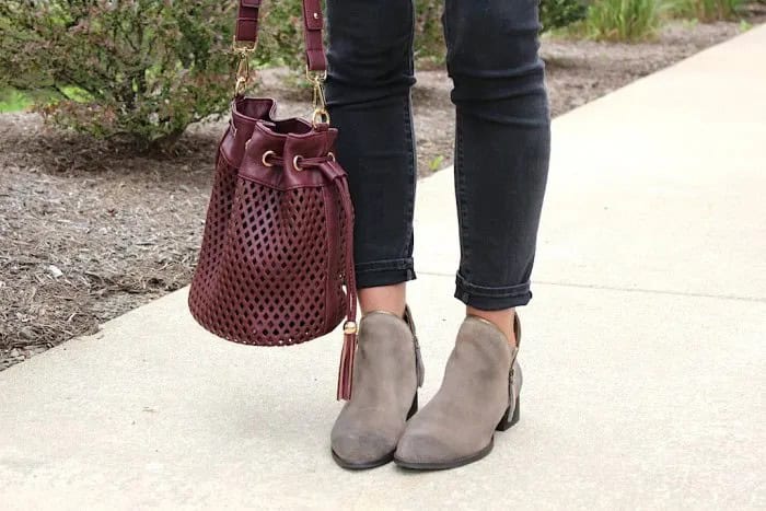 Burgundy Soft Leather Handbag with White Blouse & Black Slim Fit Ankle Jeans